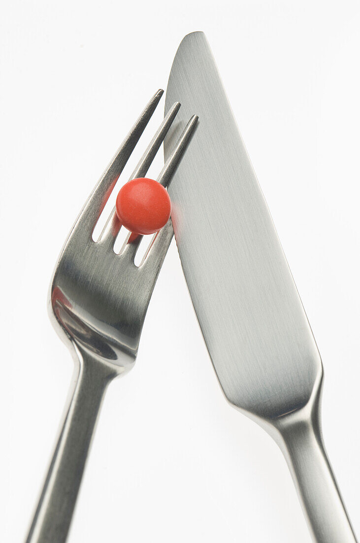 Red pill with cutlery