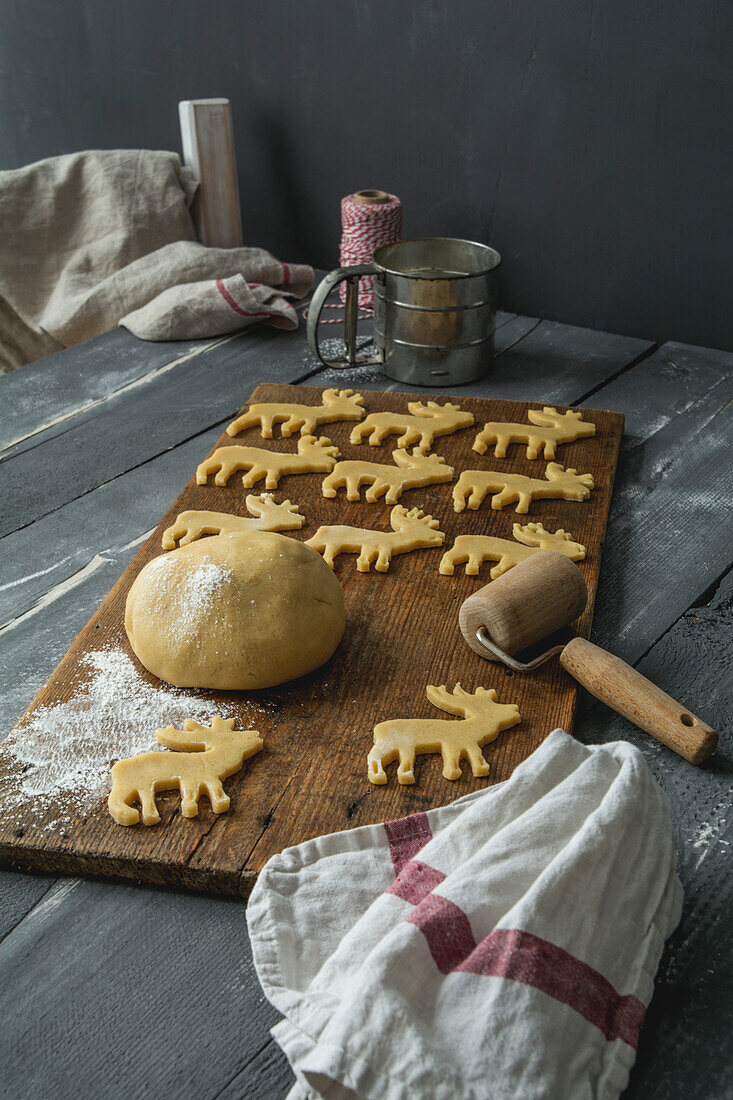 Shortcrust biscuits on wooden board, elk form, Christmas time