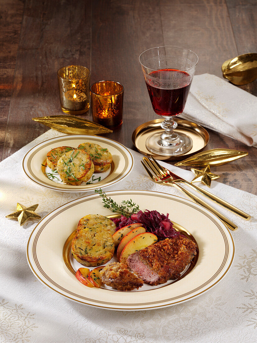 Goose schnitzel on red cabbage with napkin dumplings