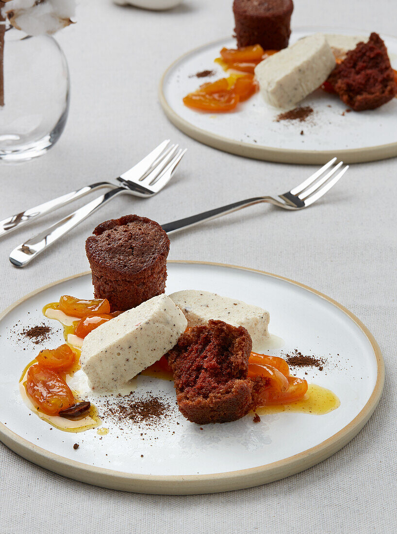 Warm chocolate cake with a kumquat ragout and a cinnamon blossom parfait