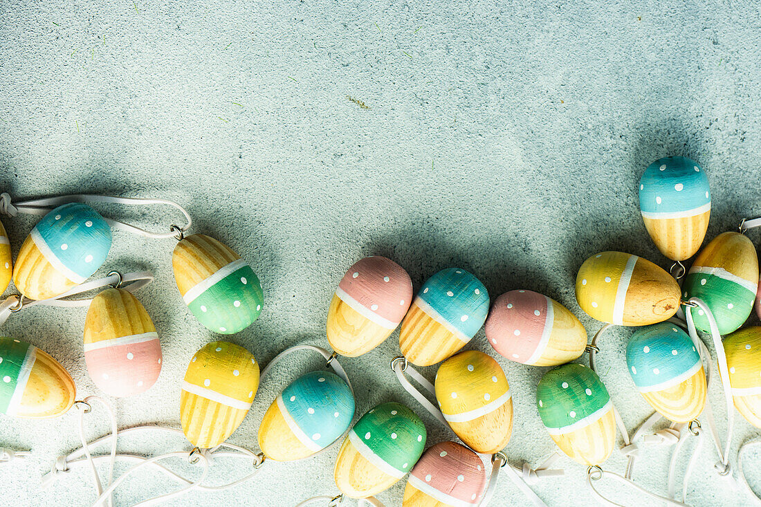 Easter holiday spring frame with wooden colored eggs