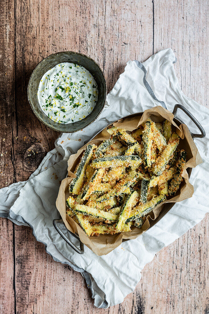 Baked courgette fries with panko breadcrumbs and parmesan cheese coating