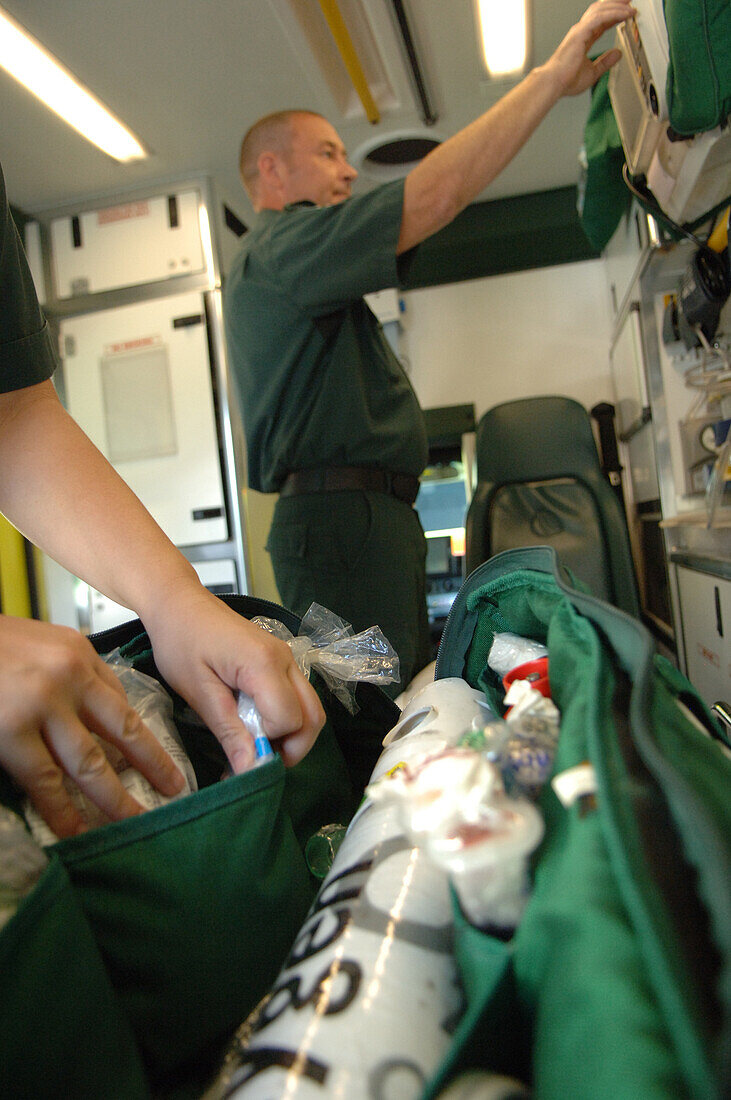 Paramedics preparing an ambulance