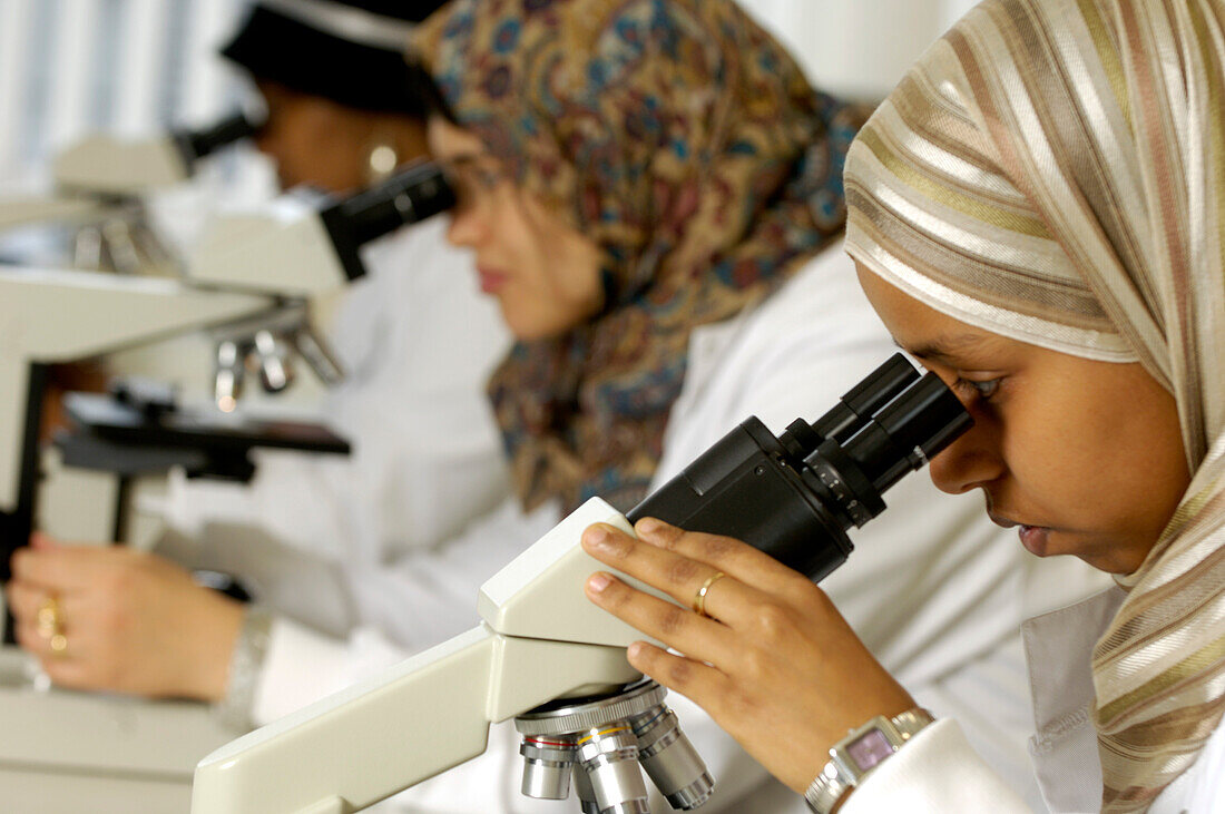 Students using microscopes