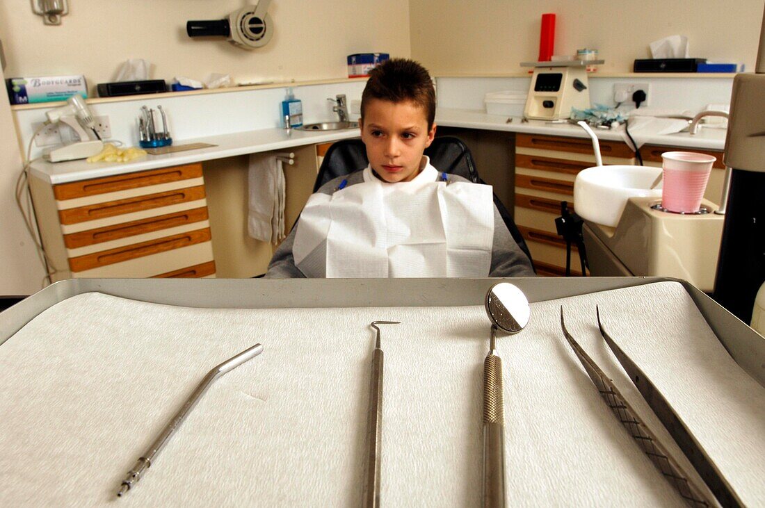 Young boy sitting in dentist's chair