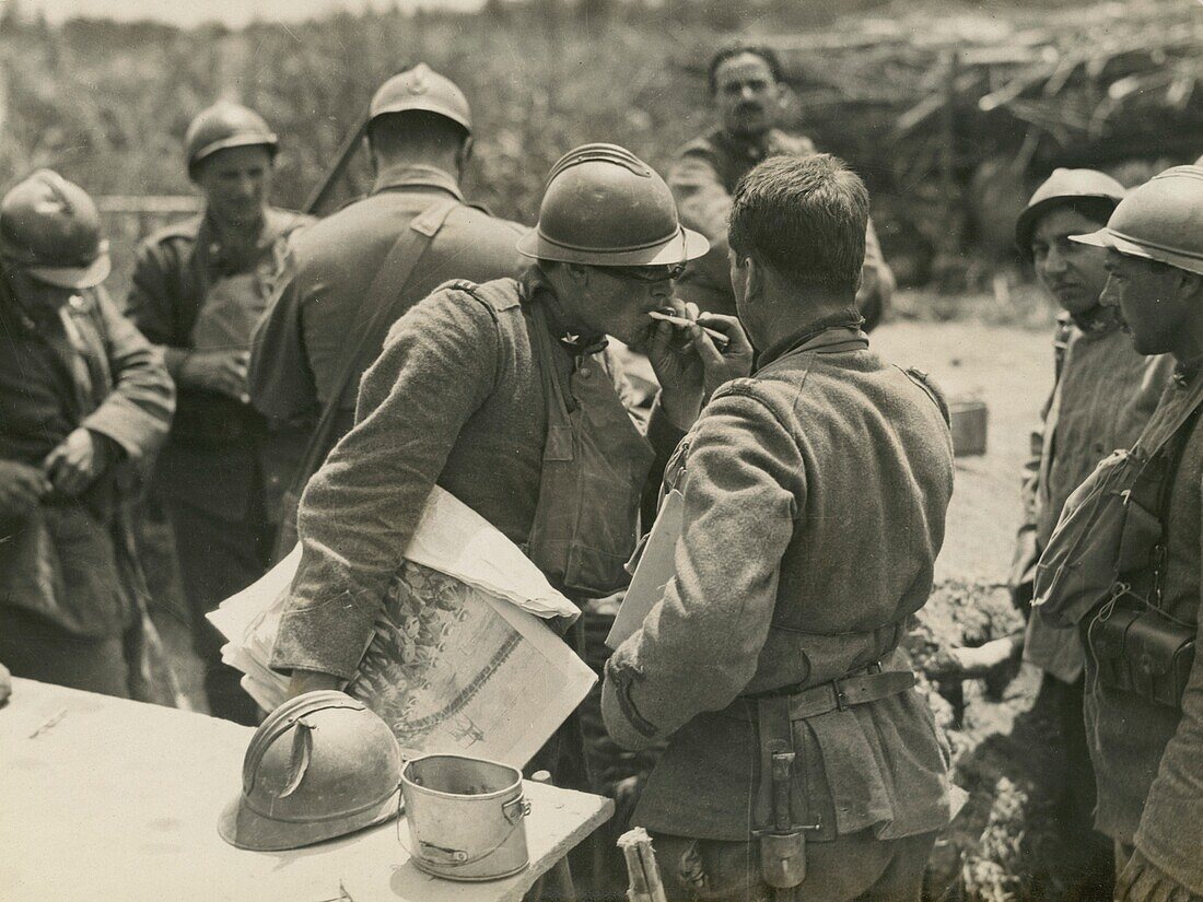 Italian soldier getting his cigarette lit by another soldier