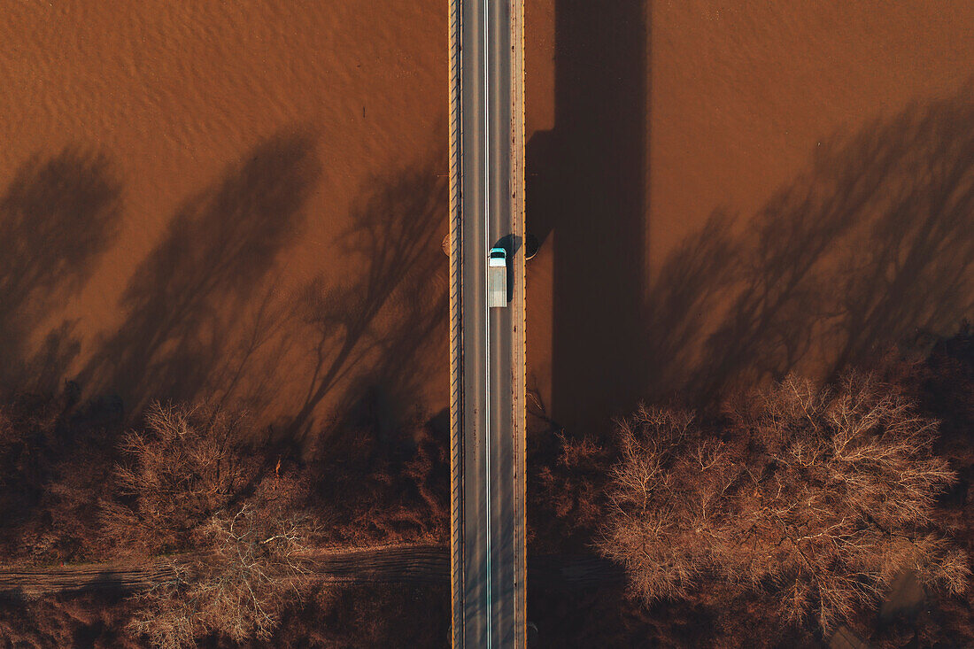 Vehicle crossing bridge, aerial view