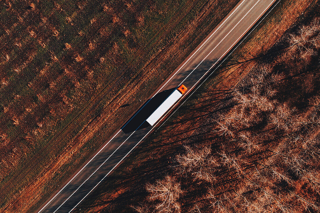 Lorry on rural road, aerial view