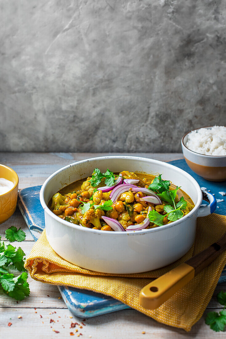 Cauliflower, chickpea and coconut vegan curry with coriander and rice