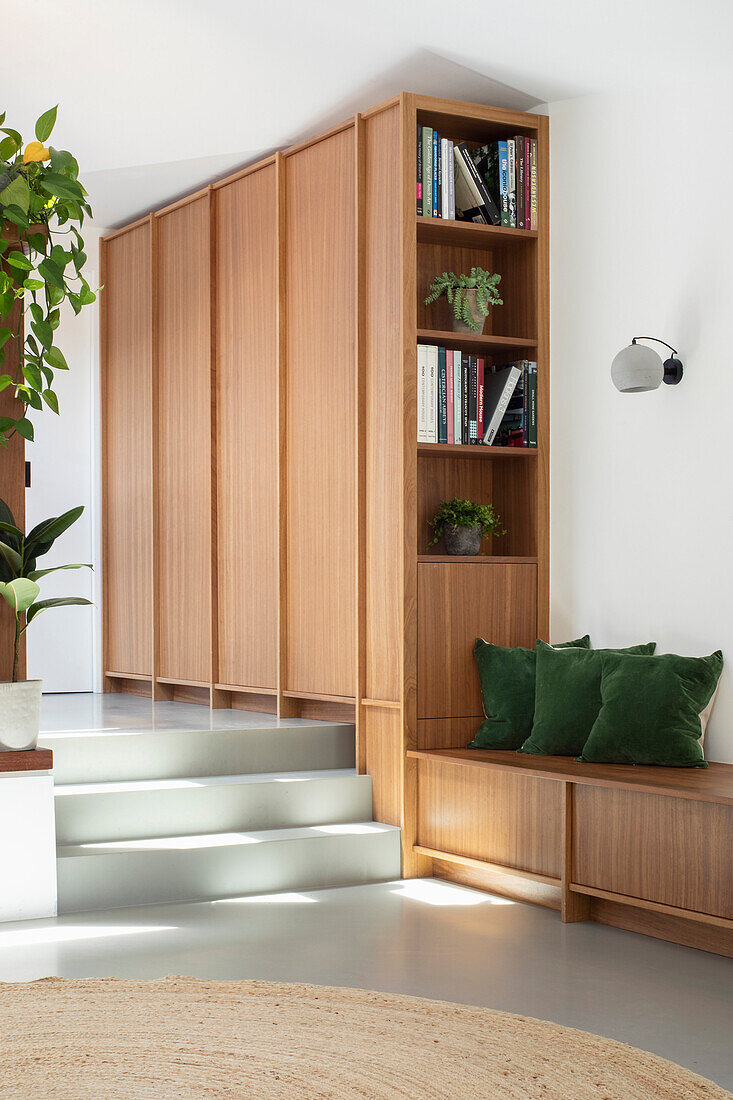 Hallway with custom-made cupboard and low sideboard used as a bench