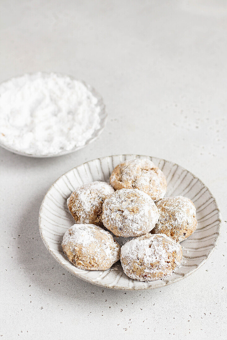 Pecan biscuits with icing sugar