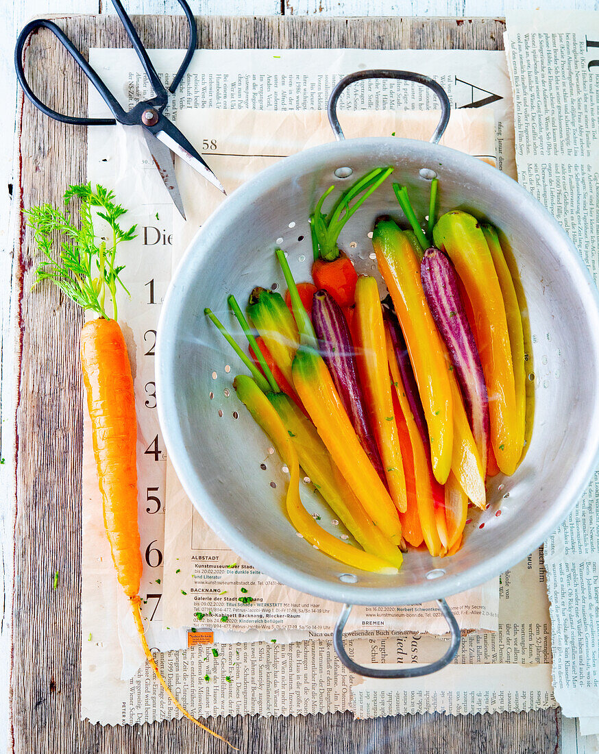 Colourful carrots in a sieve