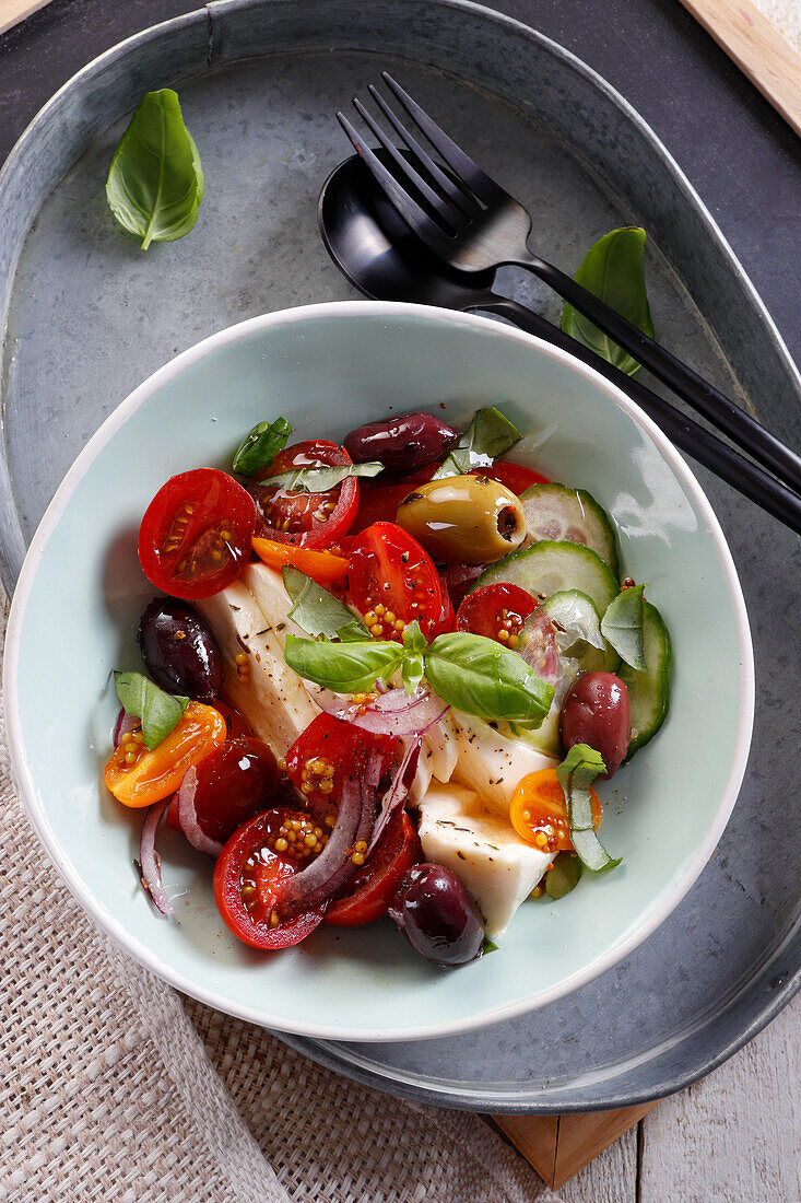 Summer salad with tomatoes, mozzarella, and olives