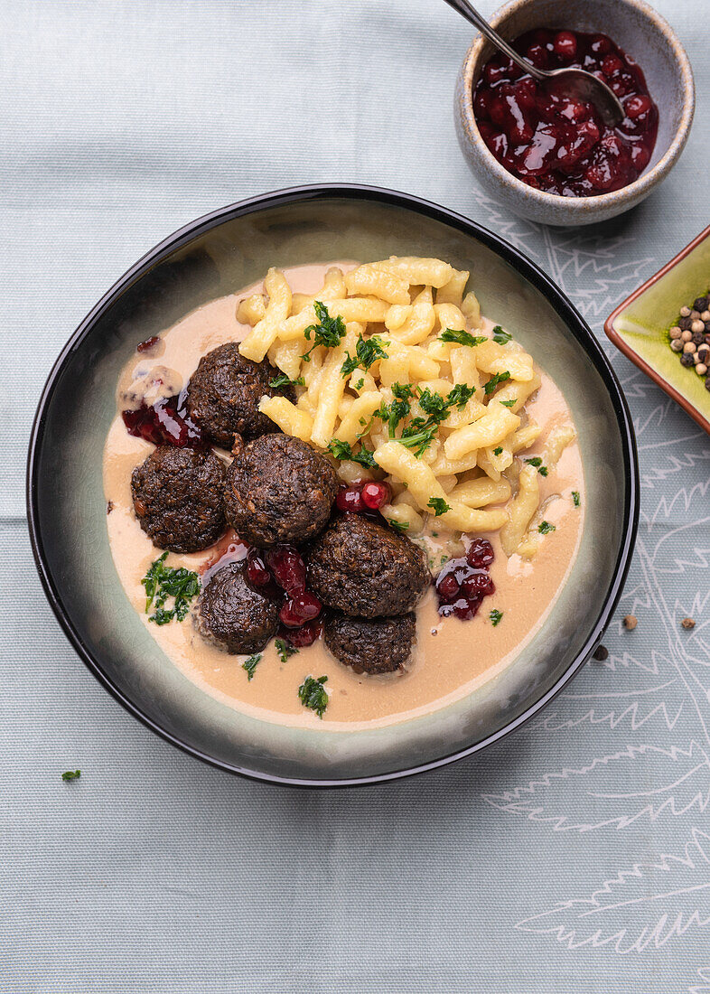Vegan 'Köttbullar' made from lentils with cranberries and spaetzle