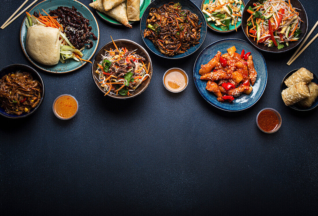 Set of Chinese dishes on table