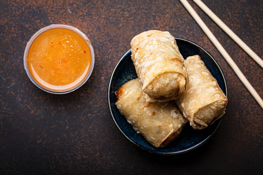 Chinese, Thai or Vietnamese traditional dish deep fried spring rolls with filling