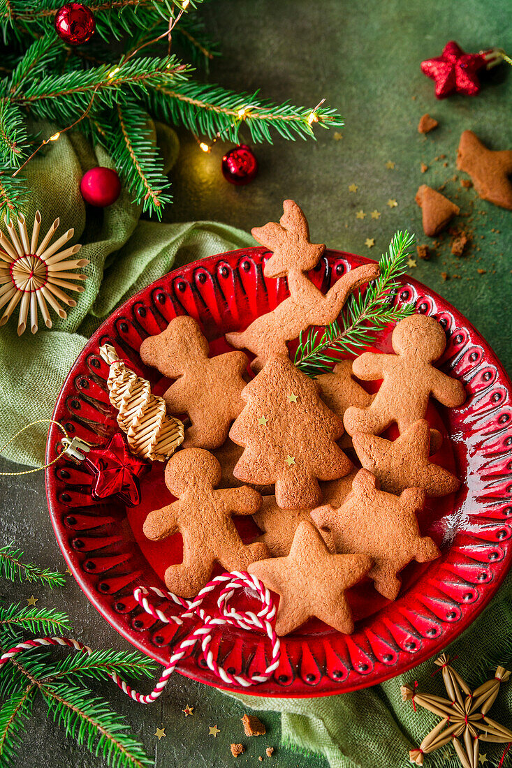 Christmas gingerbread cookies on a red plate
