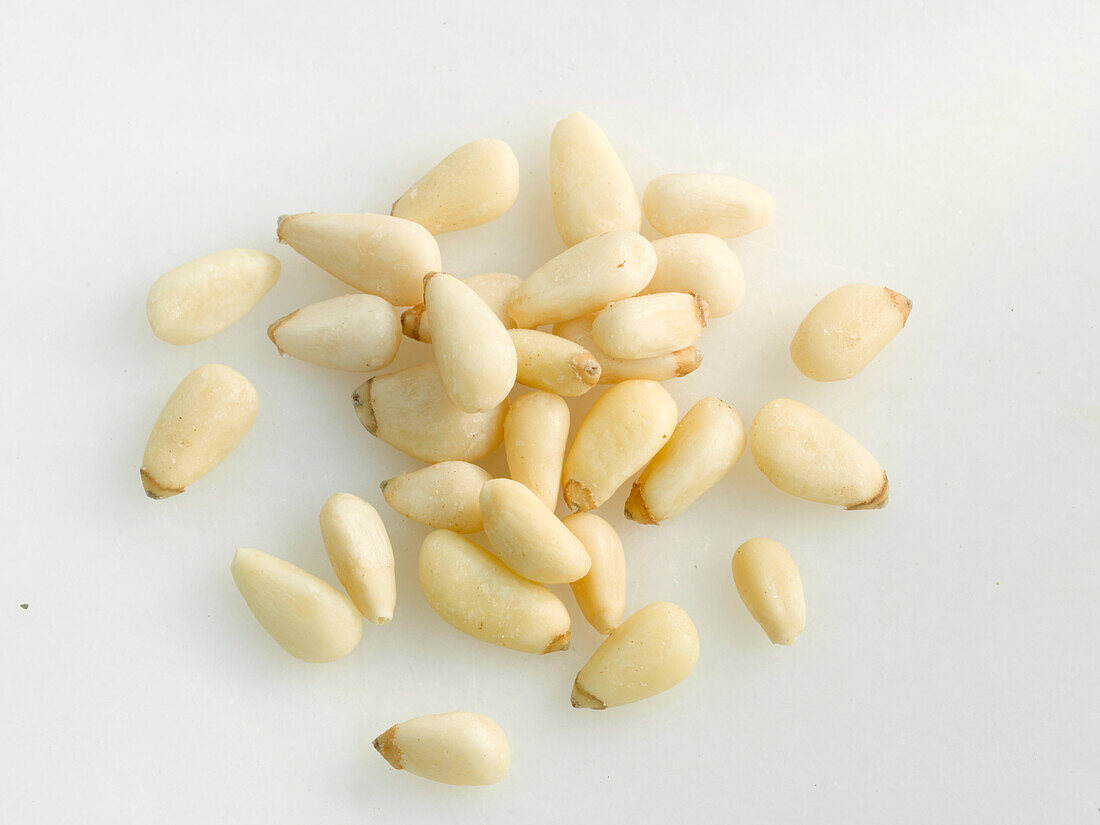 Pine nuts on a light background