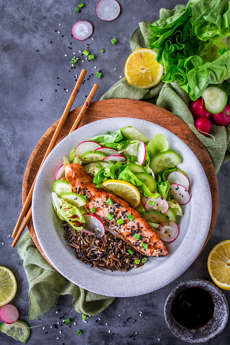 Grilled salmon with wild rice and salad