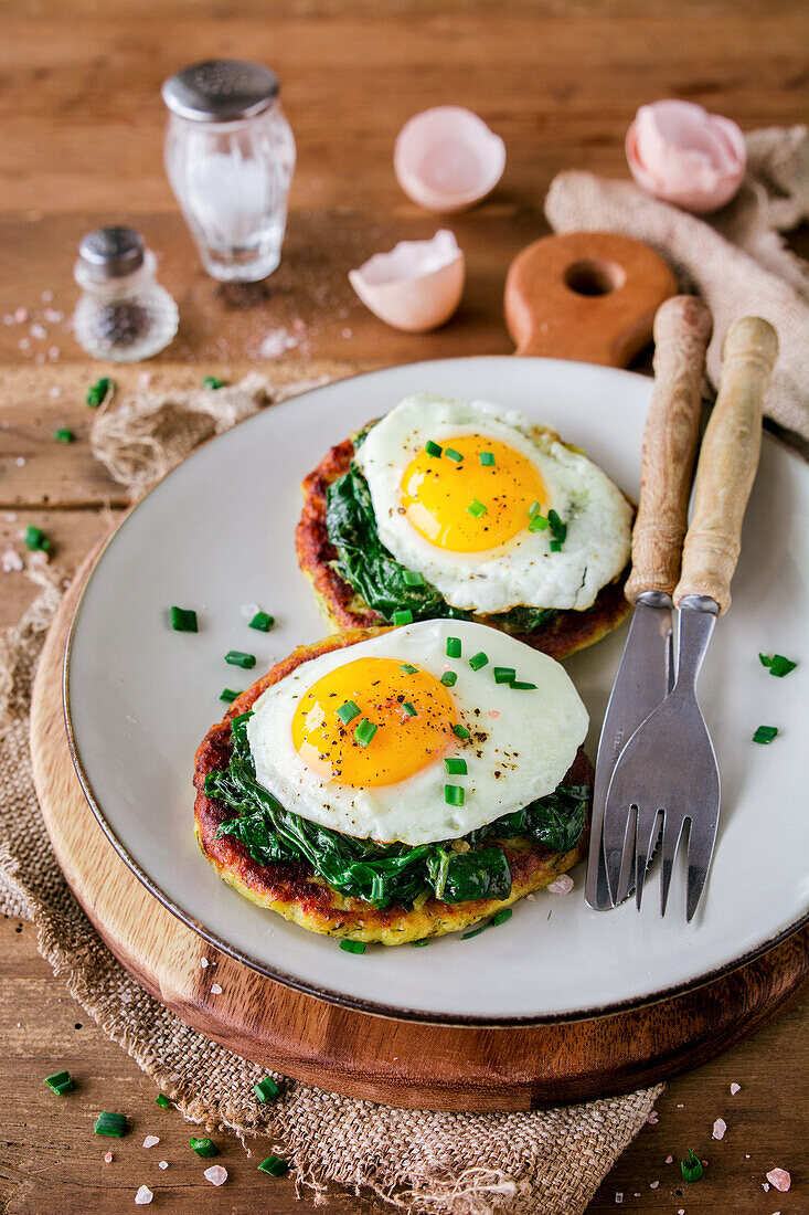 Potato fritters with spinach and fried egg