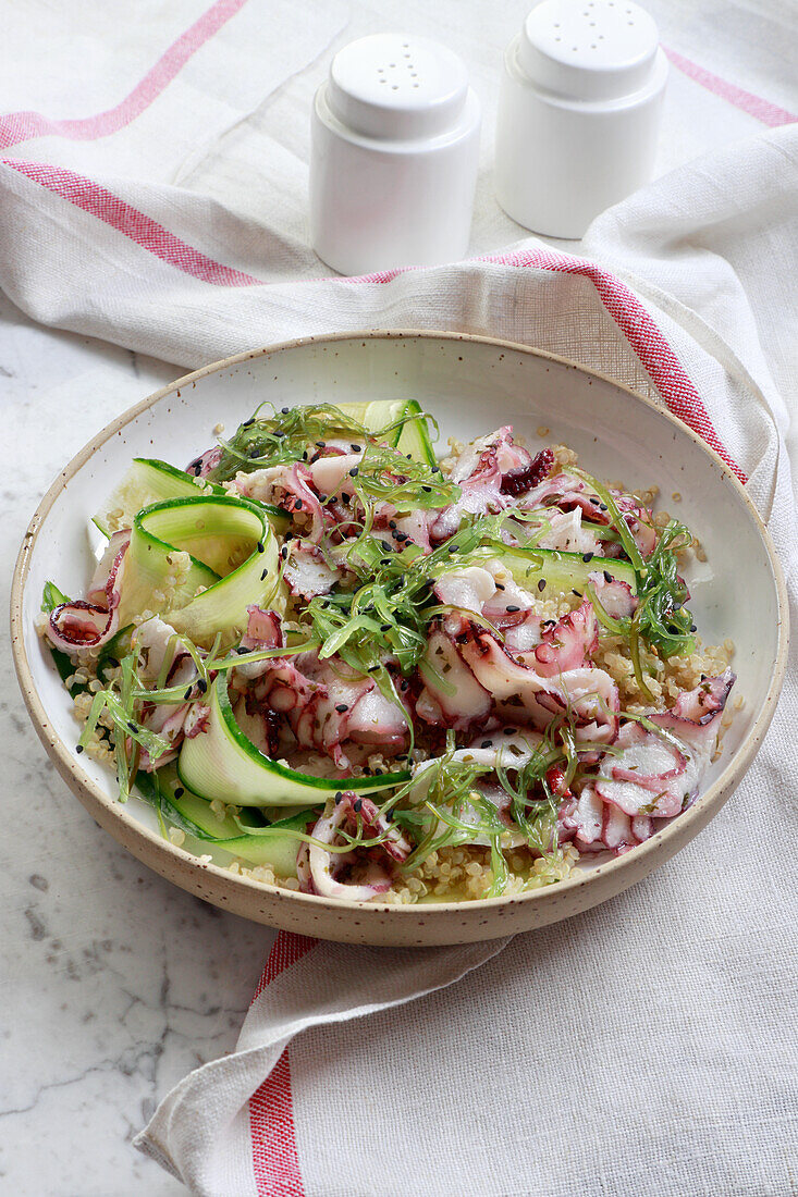 Salad with quinoa, marinated octopus and sea algae