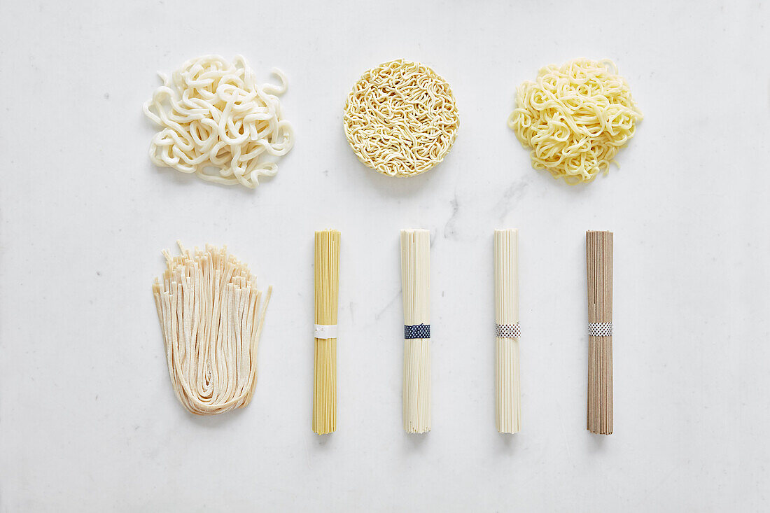 Noodles laid out on white marble