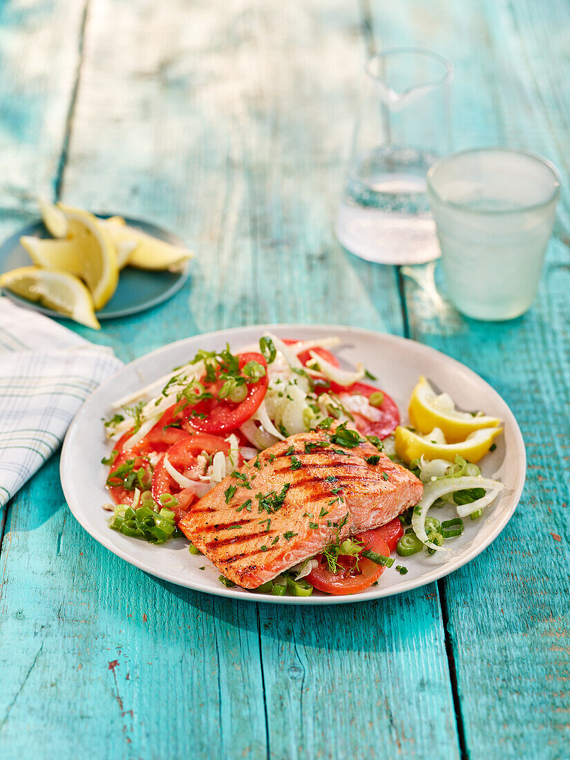 Grilled salmon steak with tomato and fennel salad