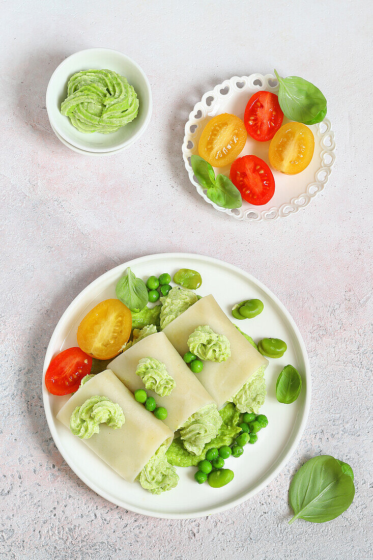 Paccheri with goat's cheese cream, peas, and broad beans