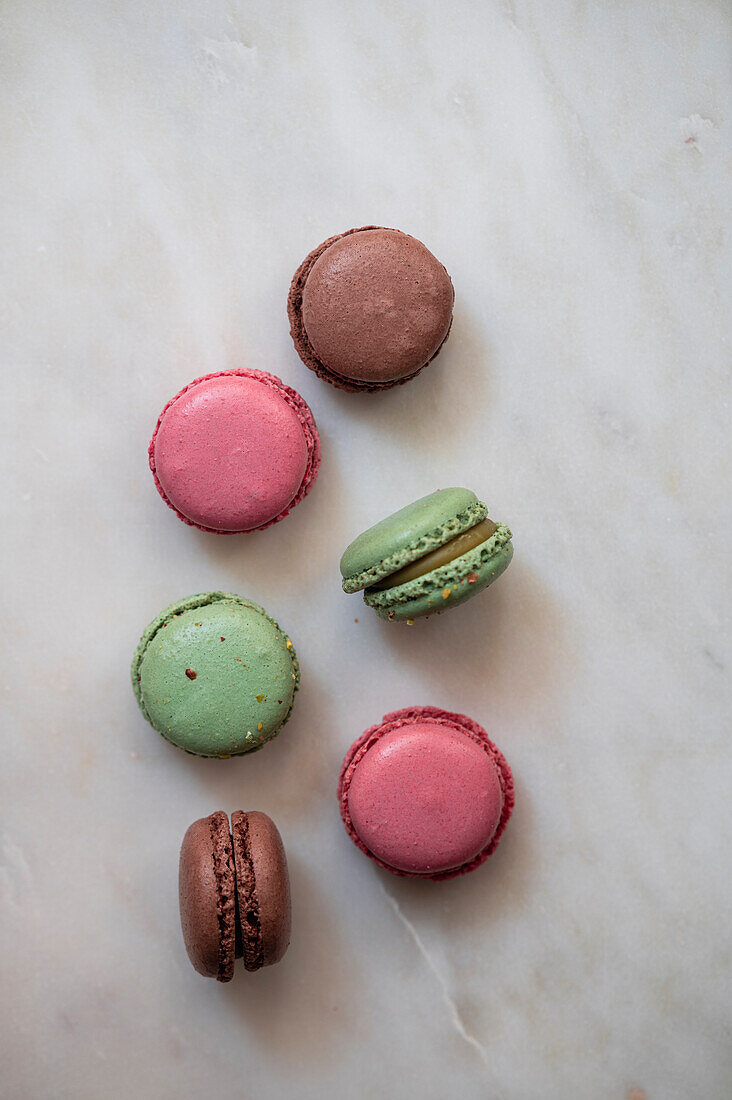 Assorted macaroons on a grey background