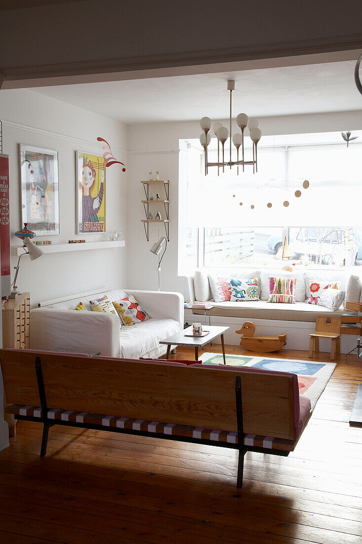 Living room with colourful retro accessories and white decor