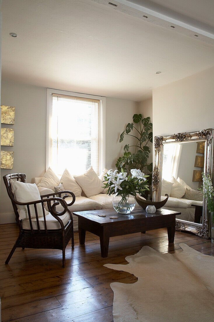 Dark wood furniture in sunlit living room