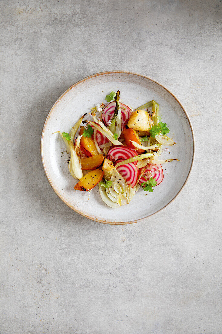 Yellow and white oven-roasted beets with fennel and chioggia beets