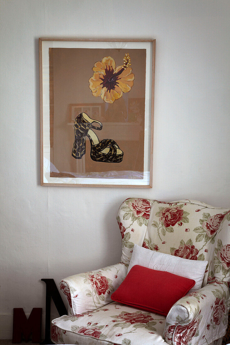 Shoe artwork and floral patterned armchair