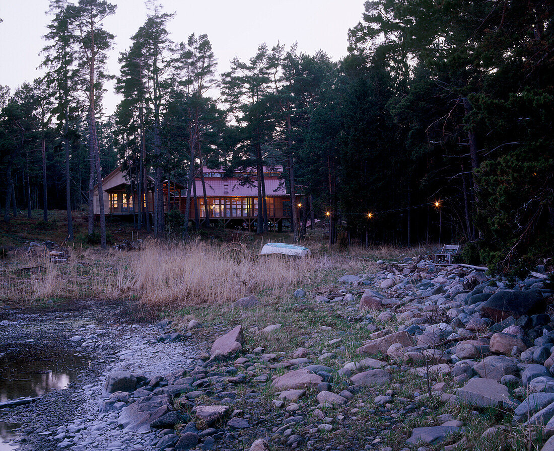 Exterior of a traditional wooden house at dusk