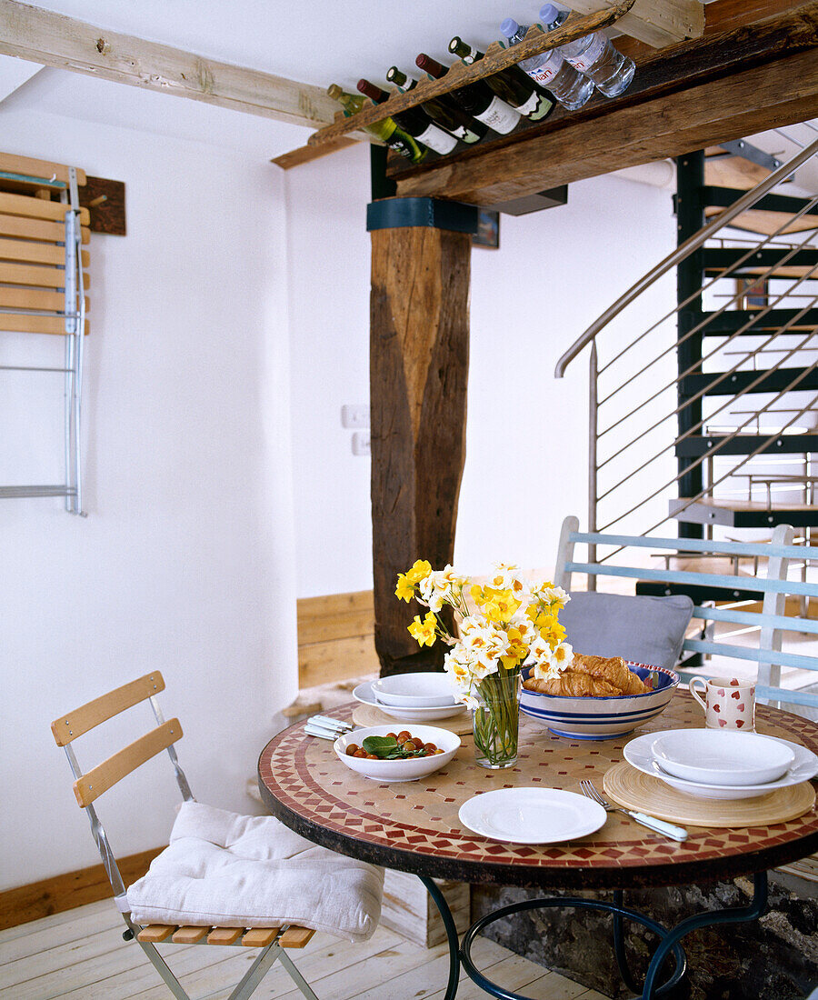 Table laid for dinner in open plan dining room