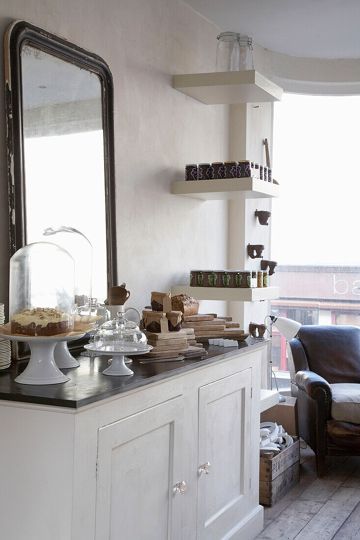 Food for sale on sideboard in cake shop