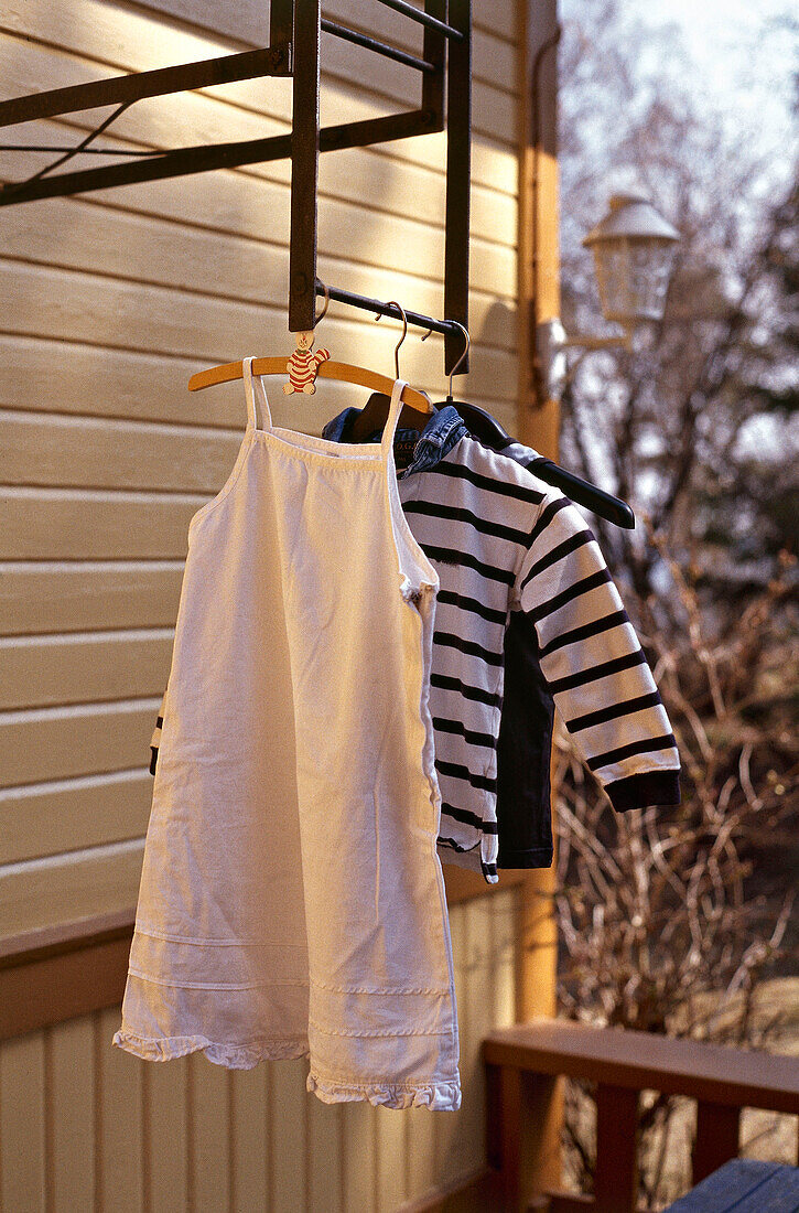 Children's clothes hanging to dry outside