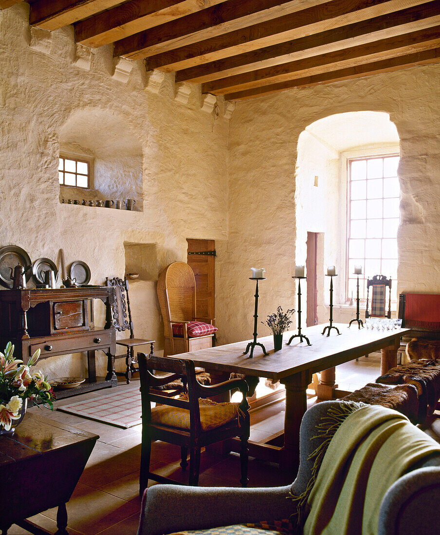 Long wooden table and chairs in dining room