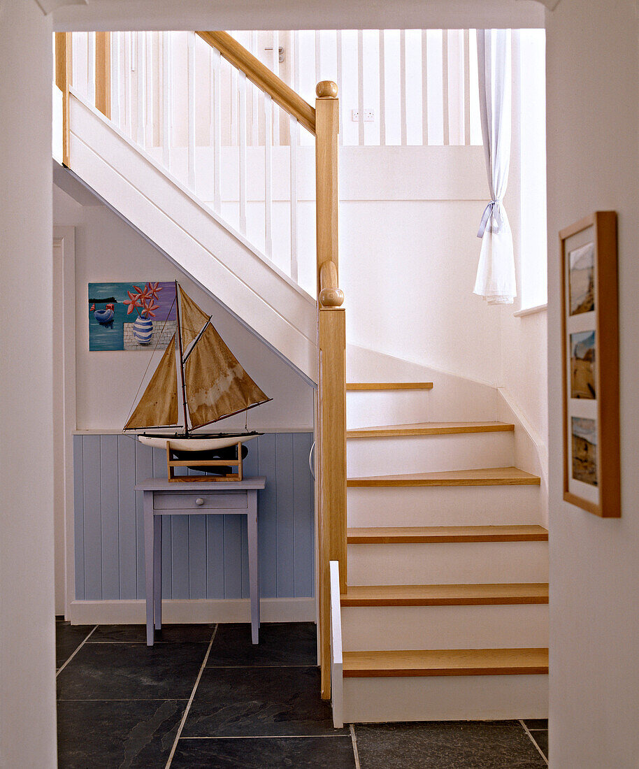 Hallway with painted panelling and model boat on table