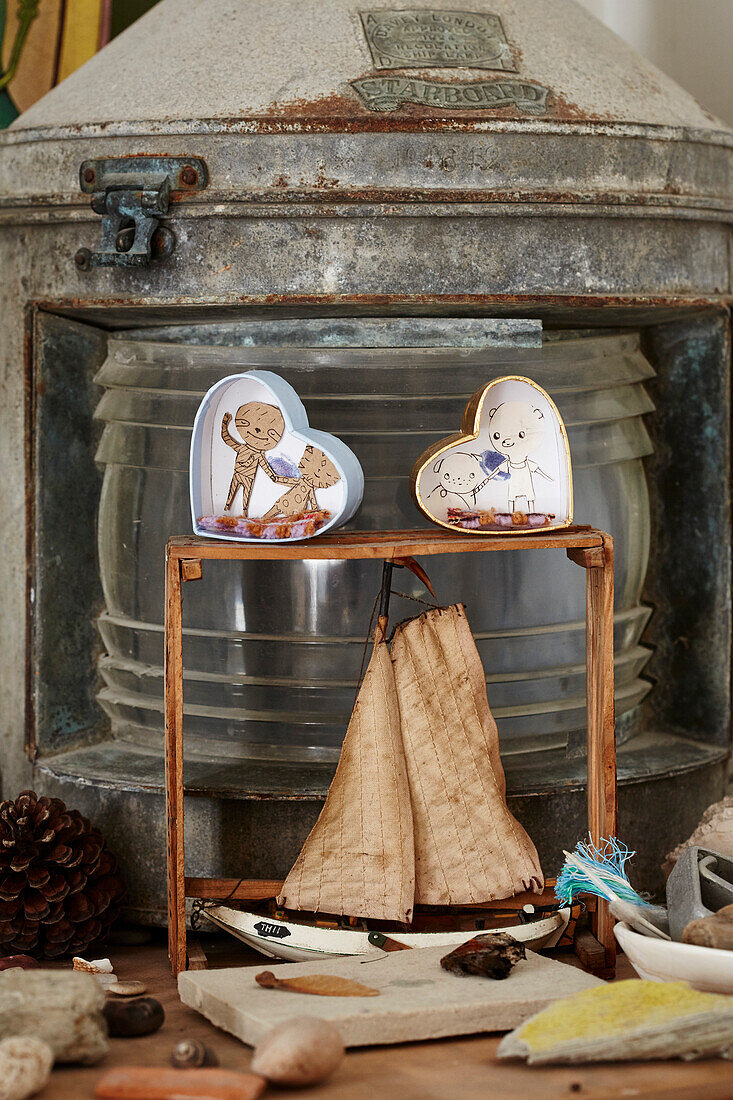 Model boat and vintage hurricane lantern in Bridport home, Dorset, UK