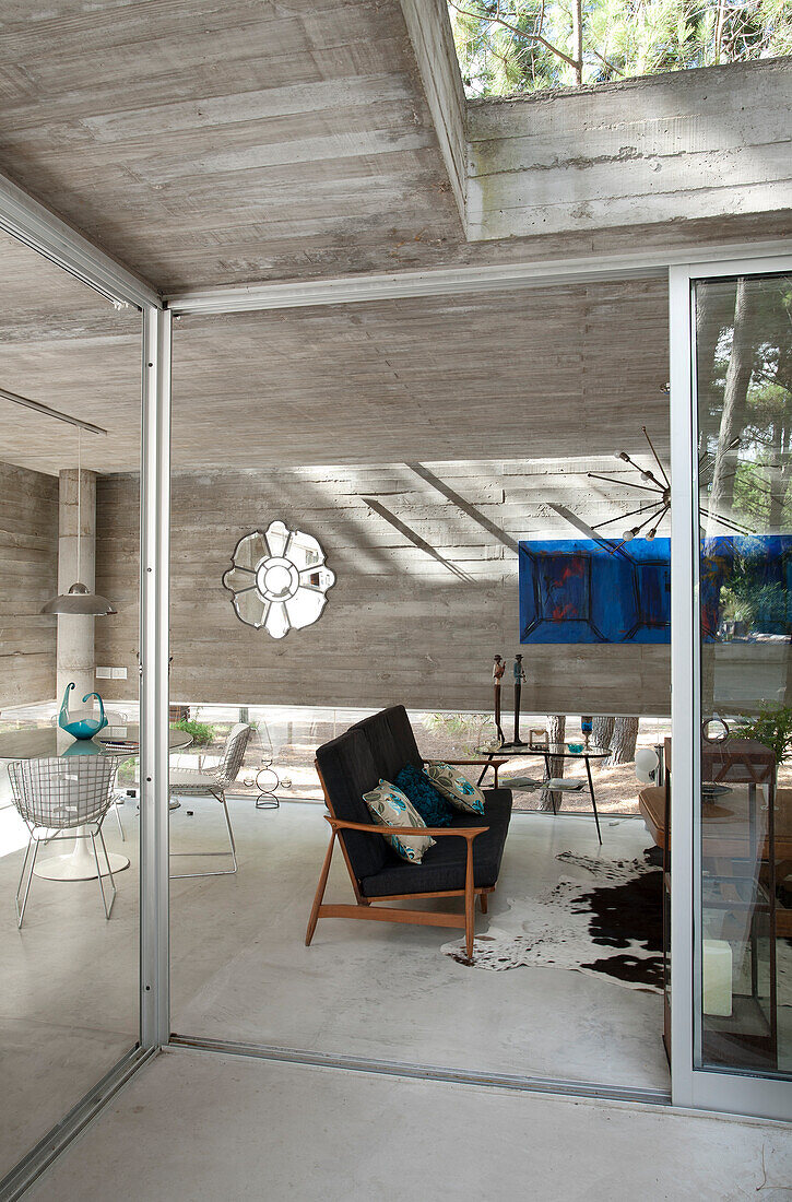 Modern concrete home in woodland, Argentina