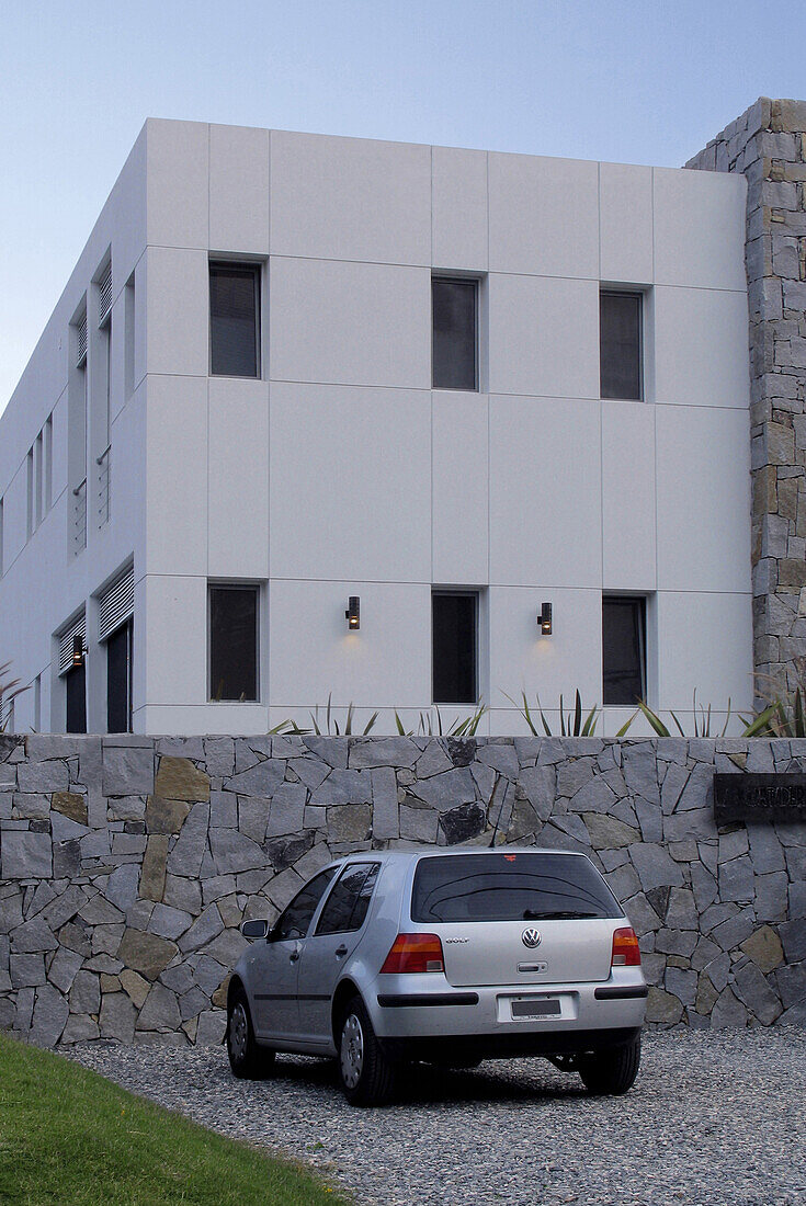 House exterior with car parked in driveway