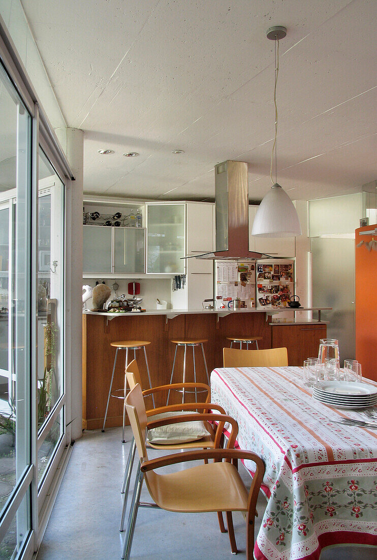 Kitchen table and chairs with bar area for three people