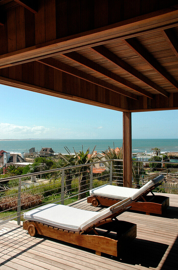 Sun loungers on decked terrace