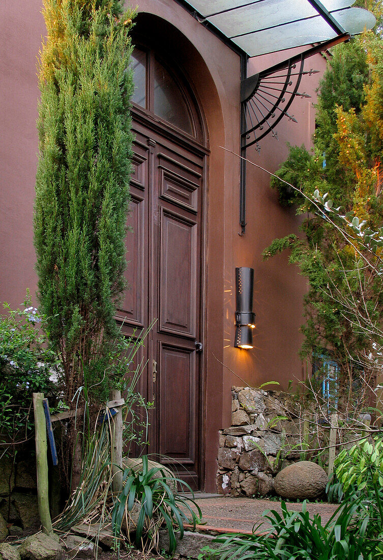 Double height doorway with glass porch cover