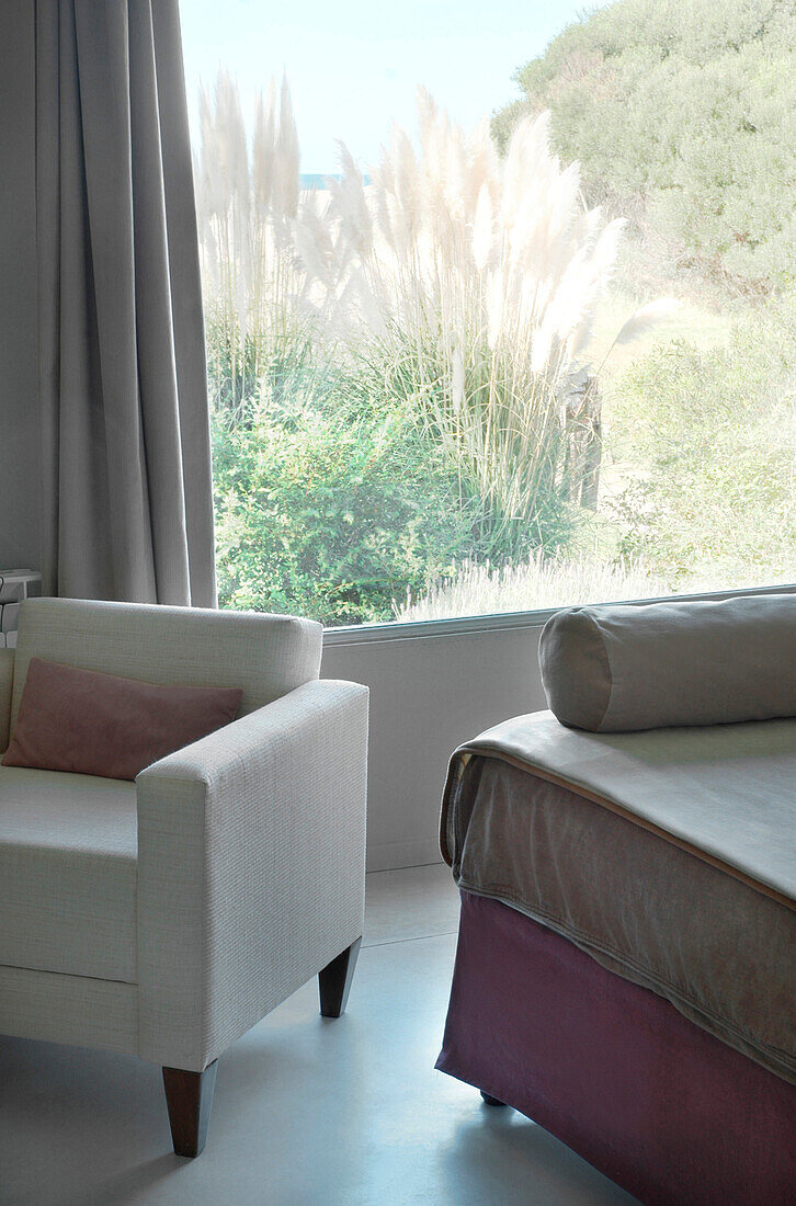 Armchair in bedroom with beach view