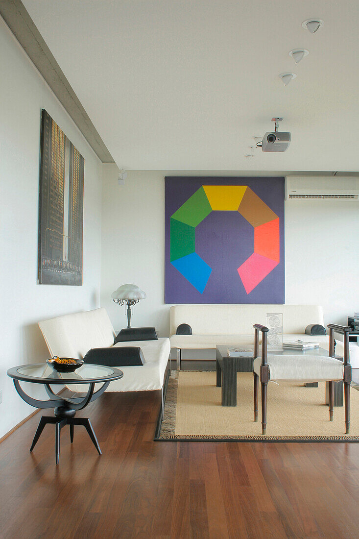 Seating area with modern art and overhead projector