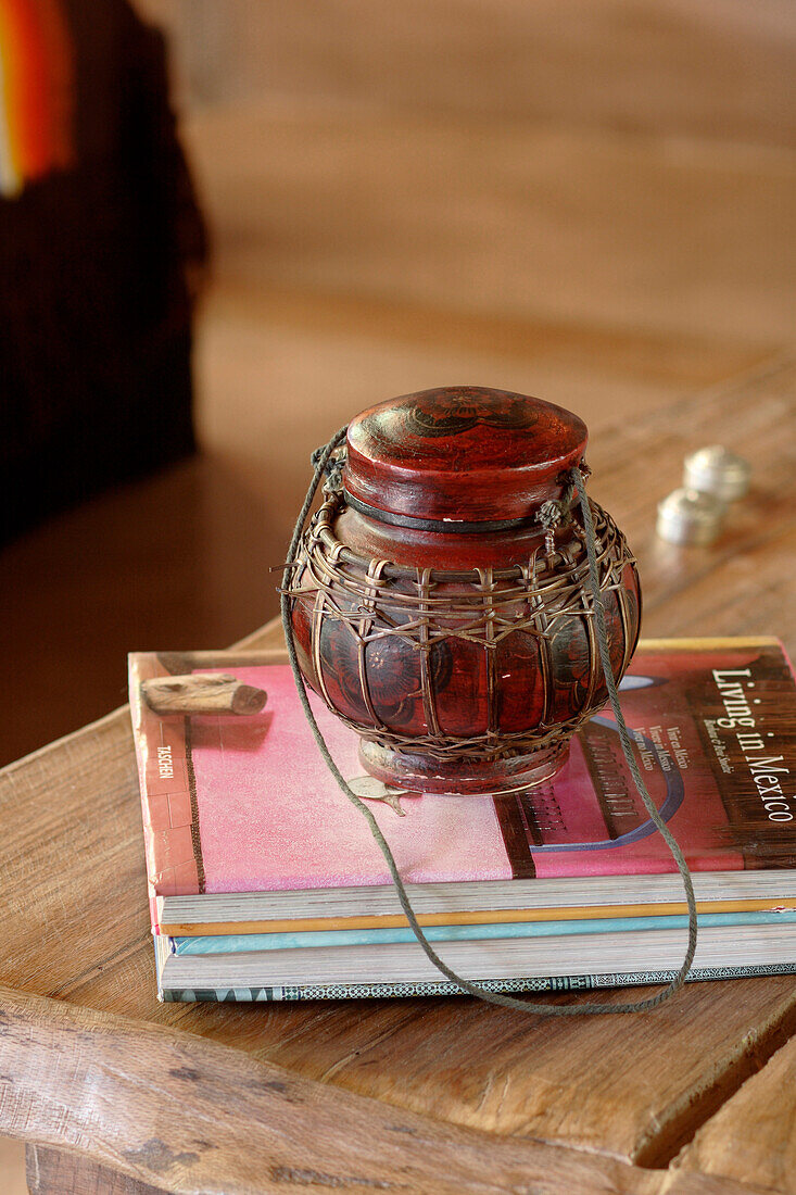 Mexican pot and book on reclaimed oak wood coffee table