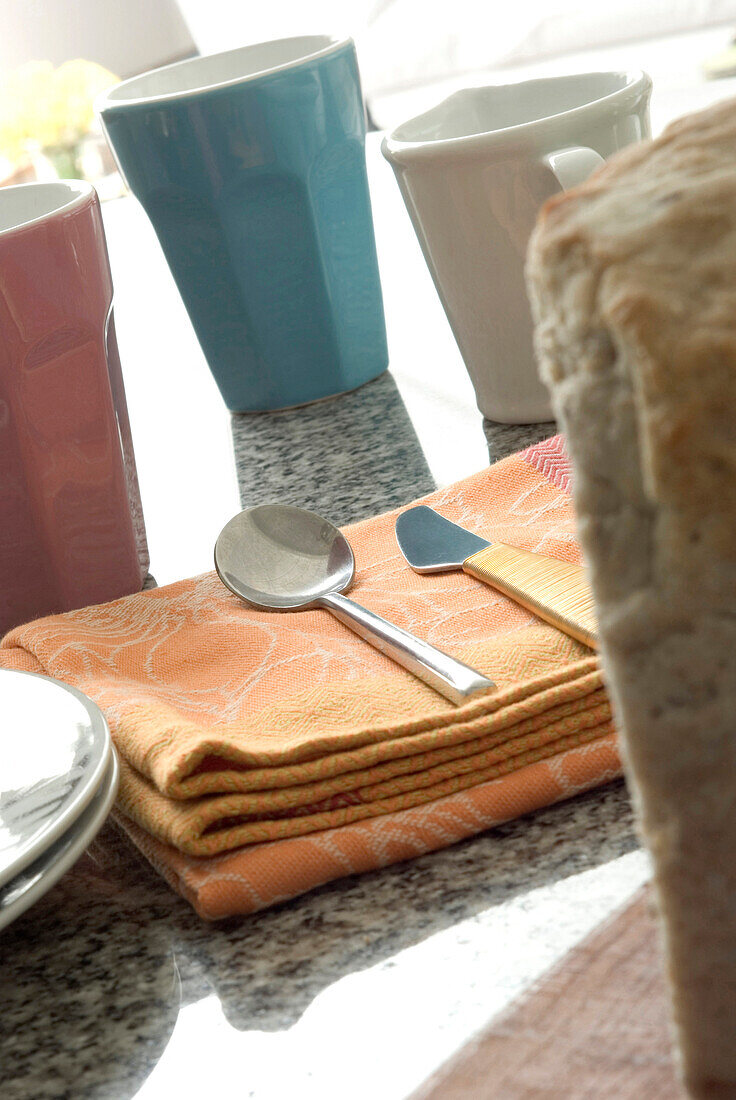 Brightly coloured tableware on marble worktop