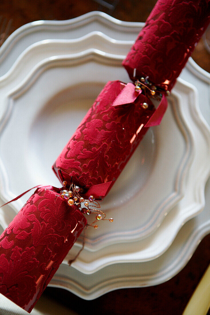 Luxury Christmas cracker on white plates